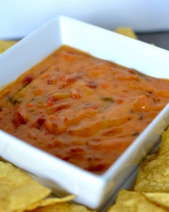 Looking for a spicy cheesy snack for game day? Check out this 2 ingredient queso dip and print your Ro*tel B3G1 coupon! #JustAddRotel #ad #CollectiveBias