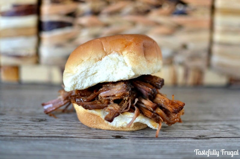 Easy Crockpot Shredded Beef Sliders: This 4 ingredient dinner takes less than 2 minutes to throw together and will have everyone asking for seconds.