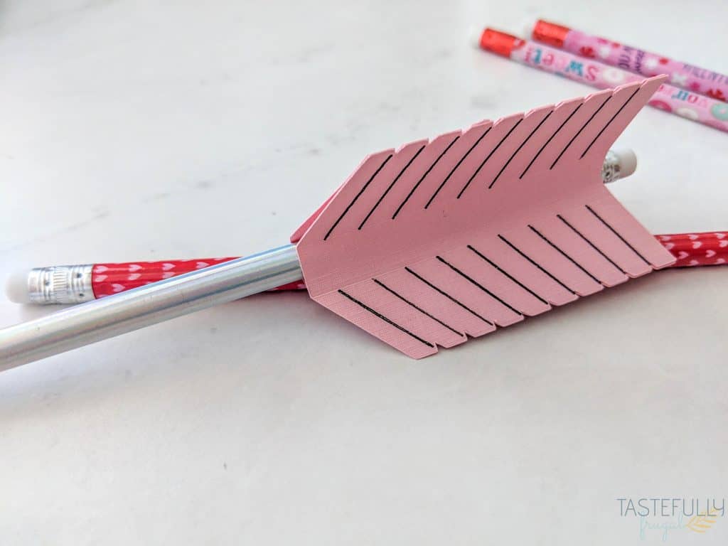 Makes these Valentines quickly and easily with a Cricut Maker. PLUS you can make an entire class' valentines for $2 or less! #ad 